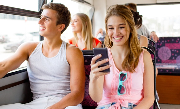 smiling couple with smartphone making selfie